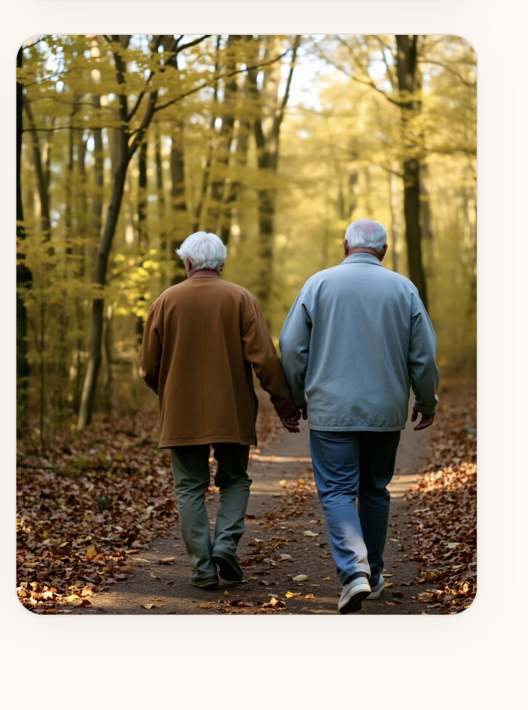 Two men walking together on a quiet autumn path